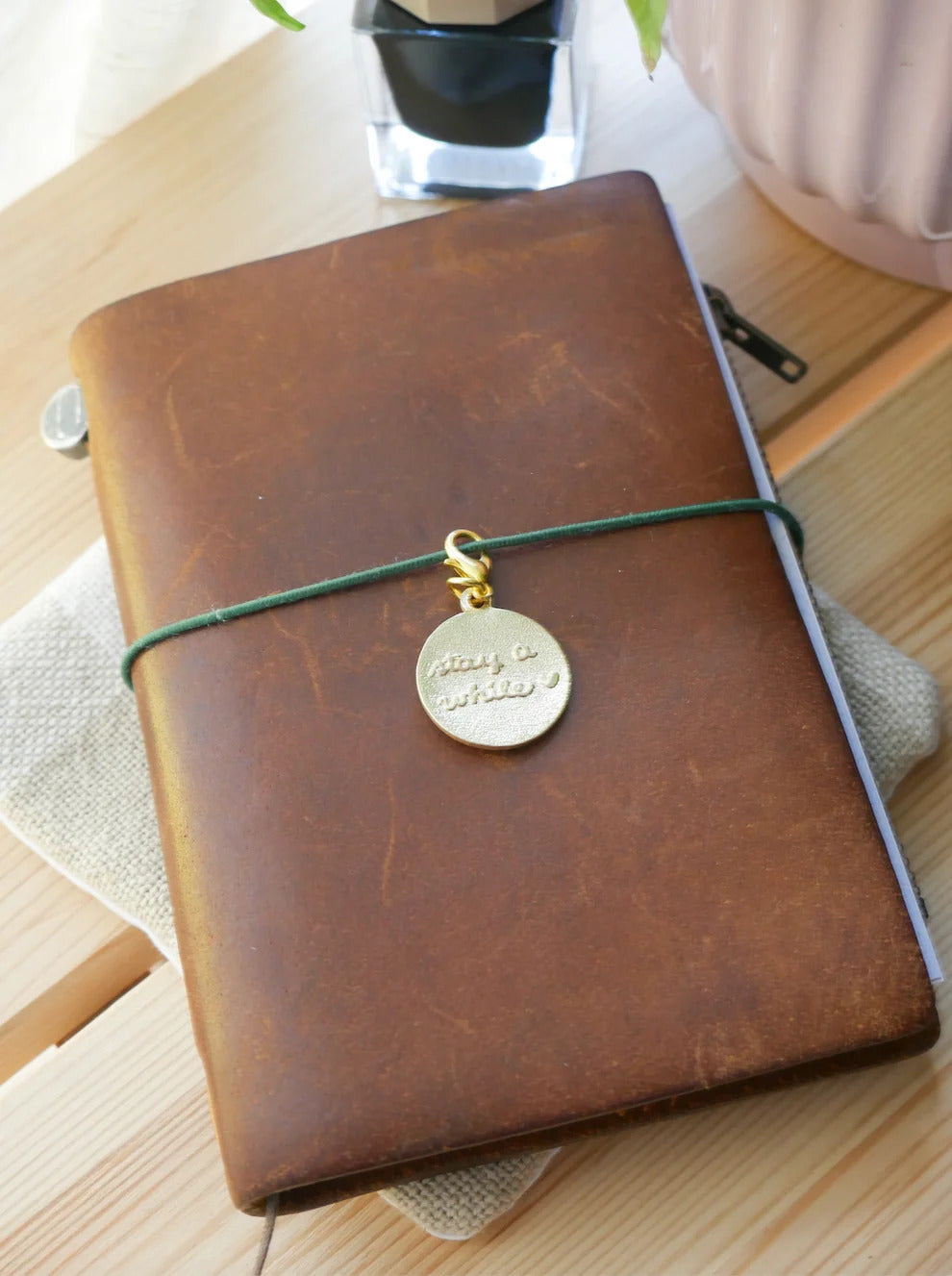 "Stay a While" Brass Charm